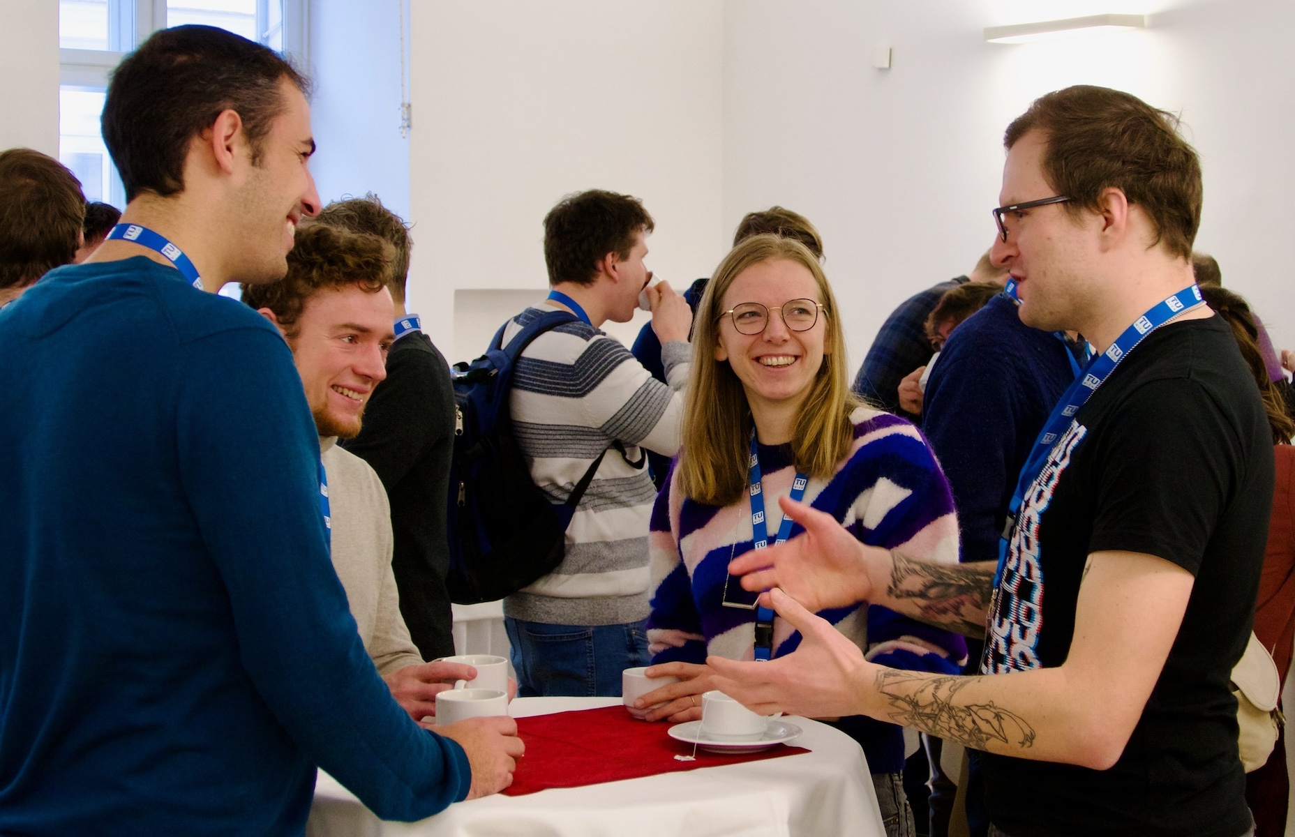 A photograph of vivid discussion of conference participants.